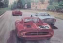 Ferrari e Porsche alla curva del Serraglio.